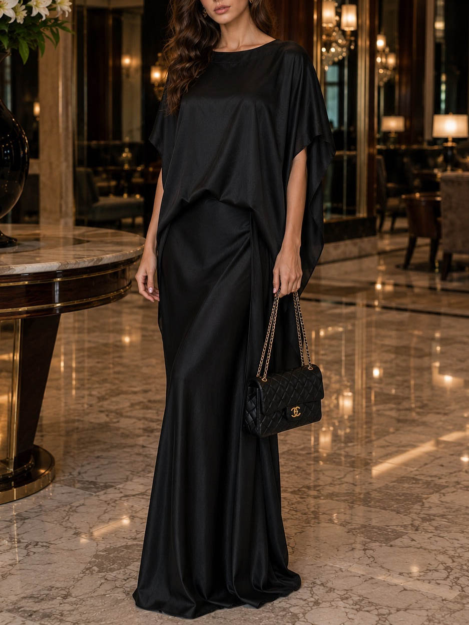 Completo elegante a due pezzi con gonna in raso e cintura drappeggiata