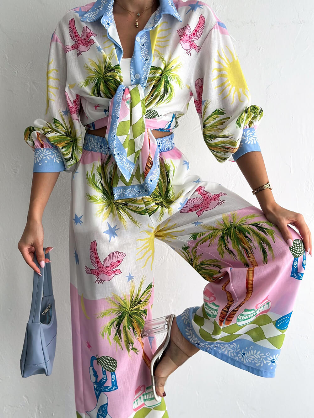 Camicia unica oversize, ampia e con bottoni, con stampa di palme sul mare