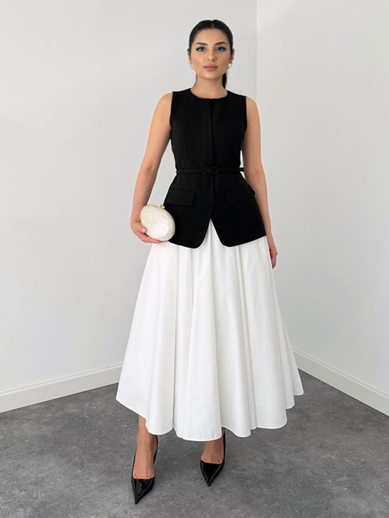 Set elegante a due pezzi con gilet senza maniche e gonna midi bianca svasata