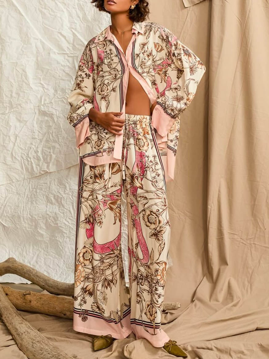 Calças elegantes de cetim com estampado floral e pernas largas