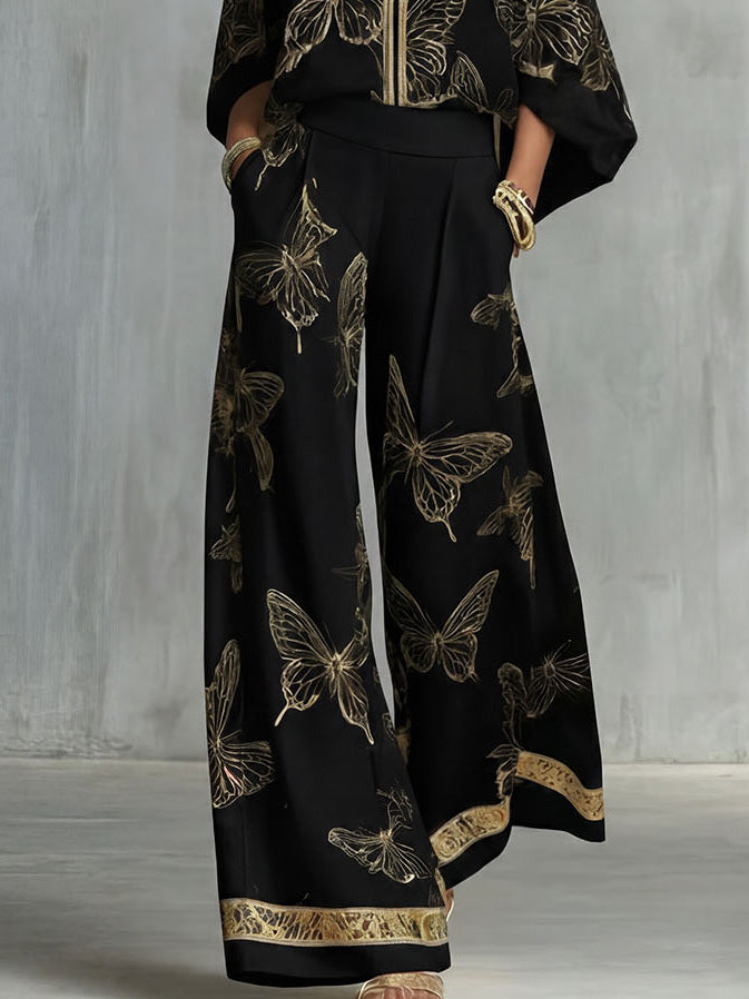Set elegante con top con zip e stampa a farfalle e pantaloni a gamba larga