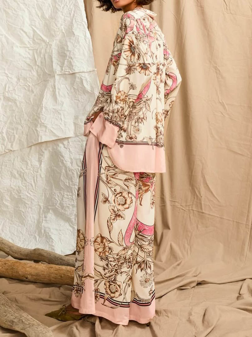 Calças elegantes de cetim com estampado floral e pernas largas