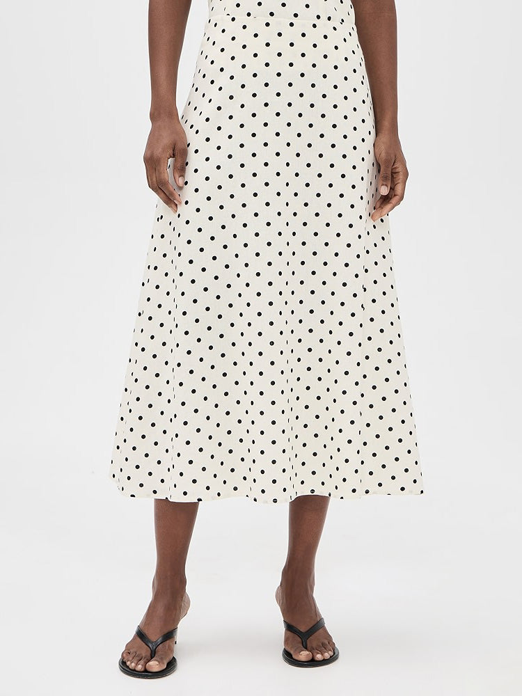 Elegante completo a due pezzi con top senza maniche e gonna a pois