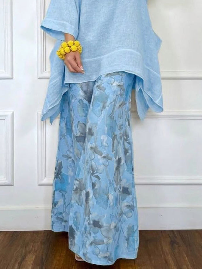 Conjunto casual com top assimétrico e calças estampadas de perna larga