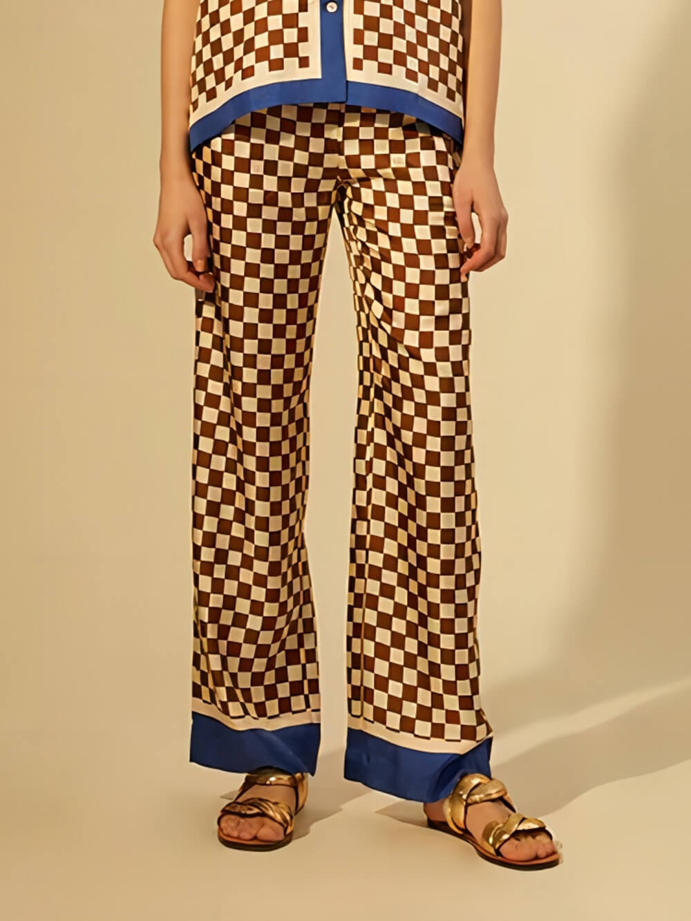 Einzigartige, locker sitzende Hose mit Schachbrettmuster, blauen Streifen und elastischem Bund