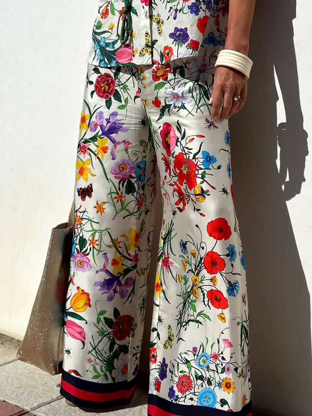 Pantaloni a gamba larga con stampa floreale esclusiva, vita elasticizzata e tasche