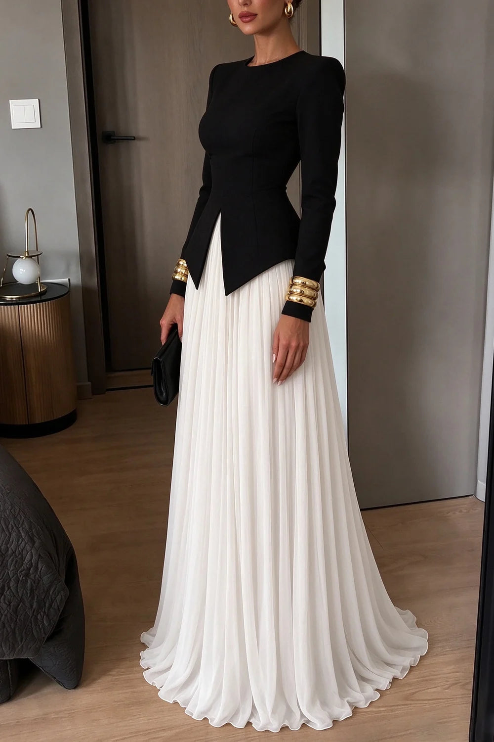 Elegante conjunto de dos piezas con top de manga larga con peplum y abertura, y falda larga plisada