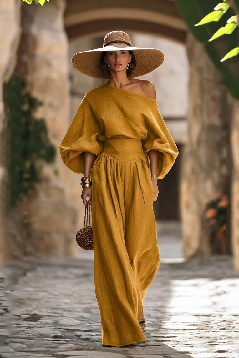 Completo con camicia a spalle scoperte e pantaloni a gamba larga