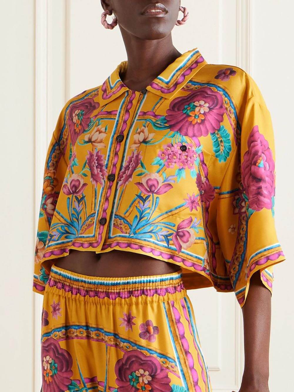 Pantaloni cropped ampi a gamba larga con stampa floreale unica nei colori del tramonto