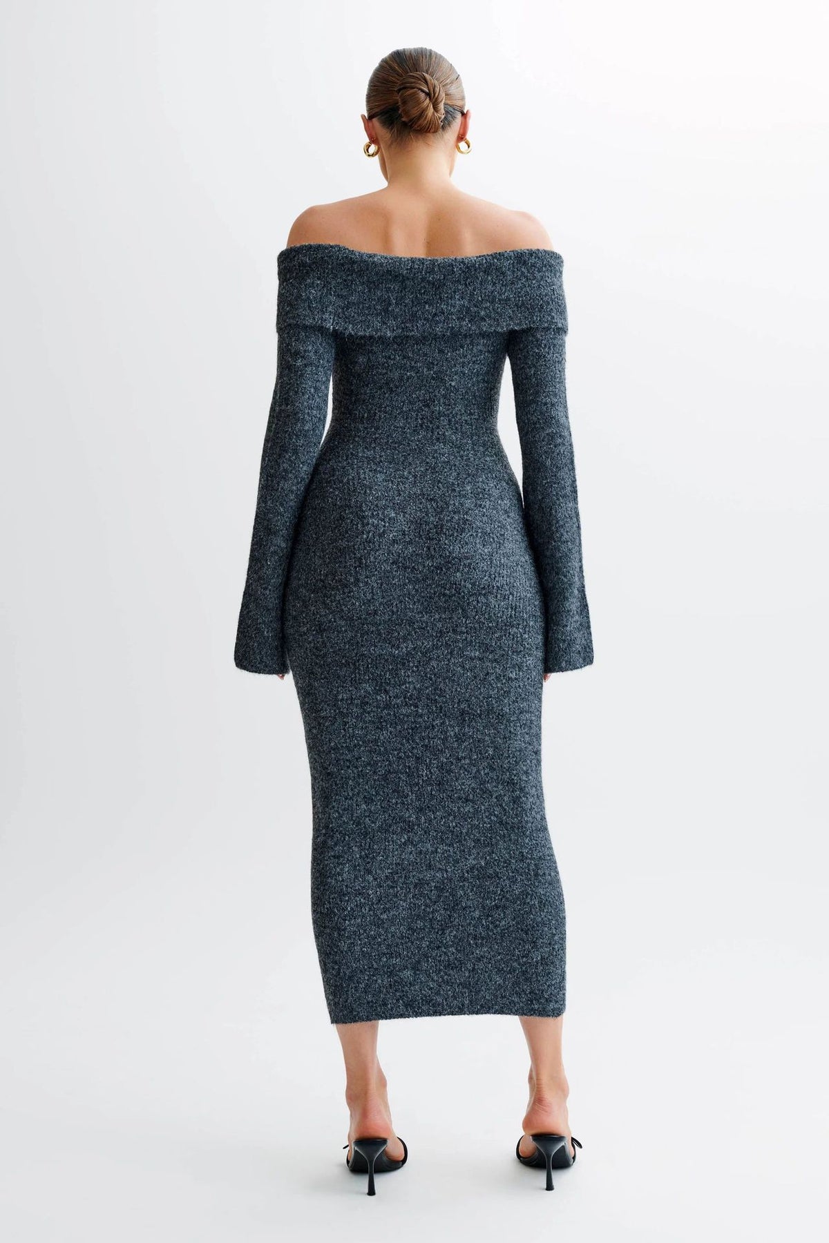 Off-the-shoulder knitted sweater dress, form-fitting, hip-hugging style.