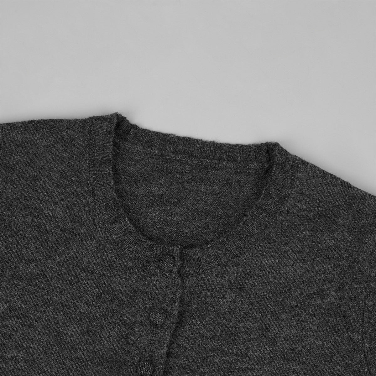 Two-piece set: fitted knit cardigan and knit mini skirt