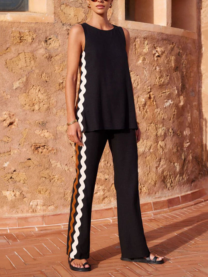 Conjunto de dos piezas con top holgado sin mangas y abertura, y pantalones de pierna ancha
