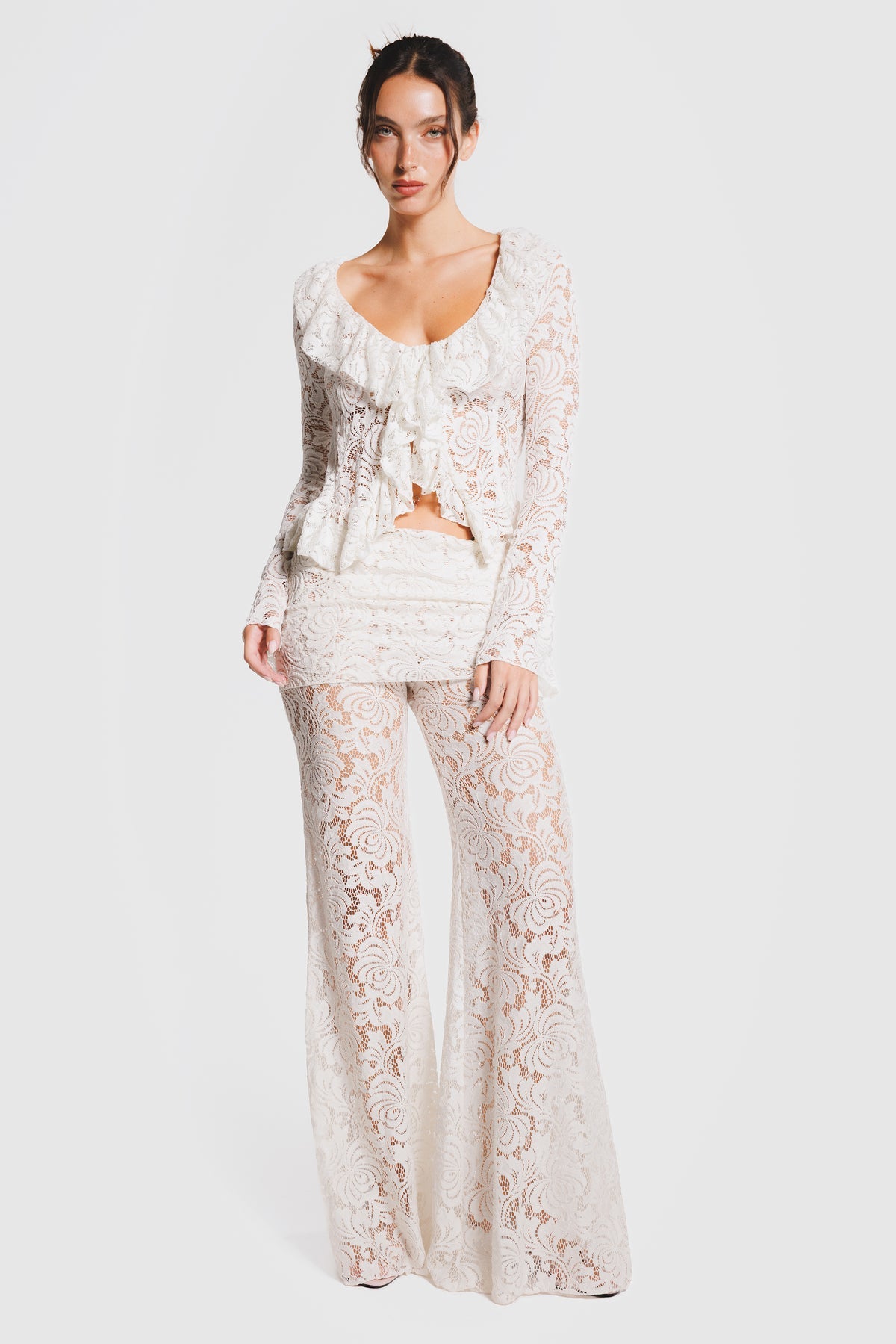 Long-sleeved shirt with ties and ruffle details, and trousers