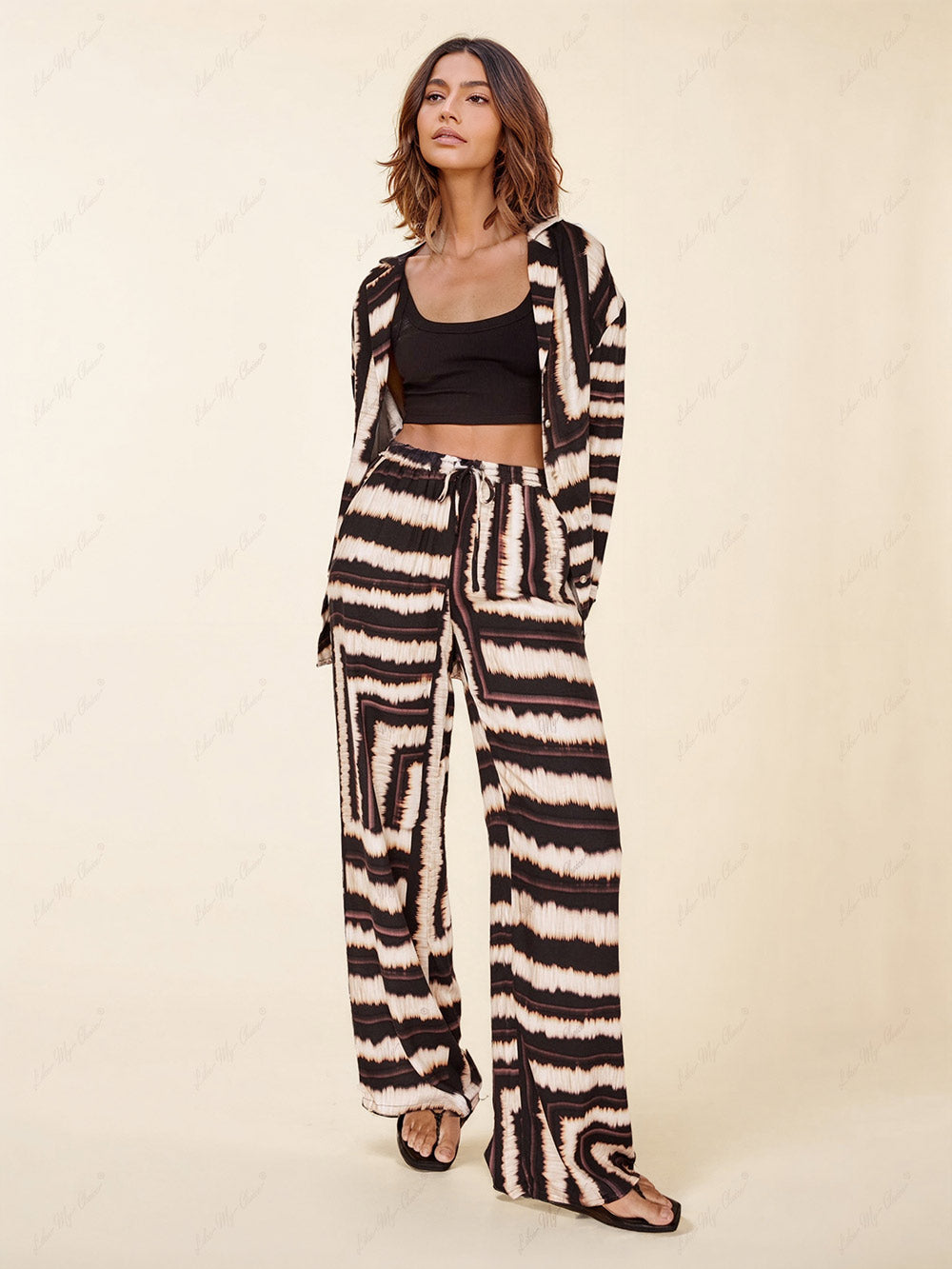 Pantalon ample en chocolat à texture rayée signature