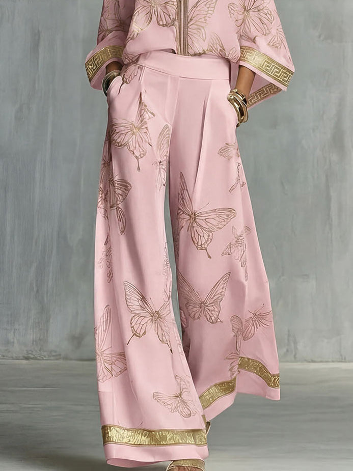 Set elegante con top con zip e stampa a farfalle e pantaloni a gamba larga