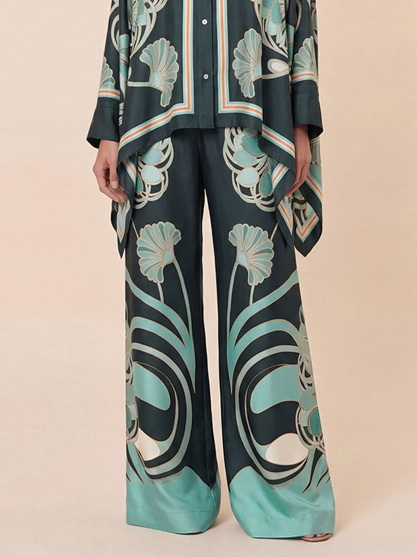Eleganti pantaloni a vita alta e gamba larga con stampa astratta