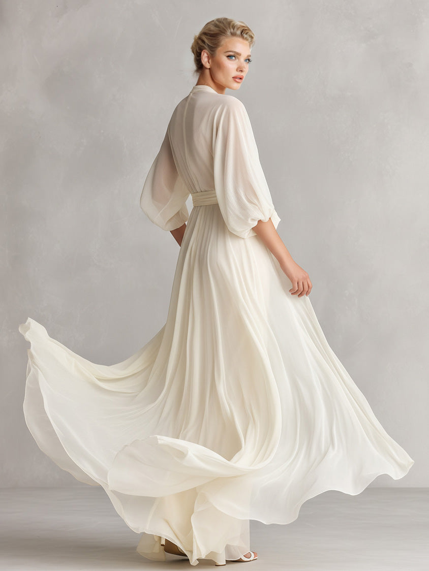 Abito lungo elegante in chiffon con maniche a sbuffo e scollo incrociato