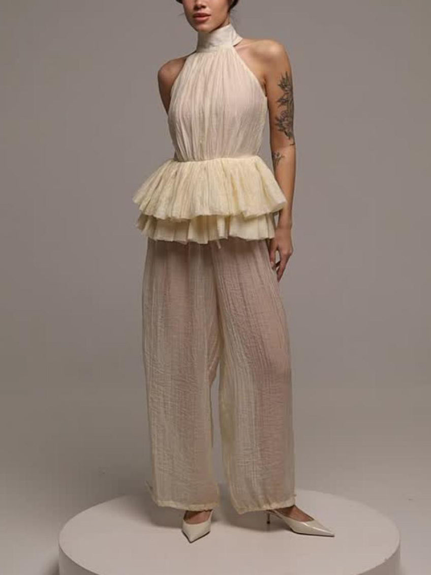 Elegante completo a due pezzi con top con volant e schiena scoperta e pantaloni a gamba larga