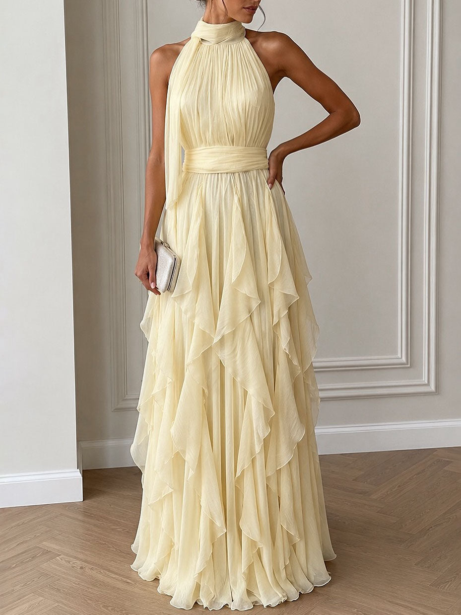 Vestido largo elegante con espalda descubierta, frunces y volantes en capas
