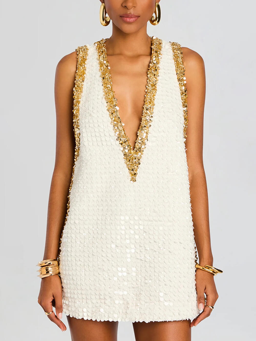 Elegante abito mini svasato senza maniche con scollo a V e bordi a contrasto con paillettes