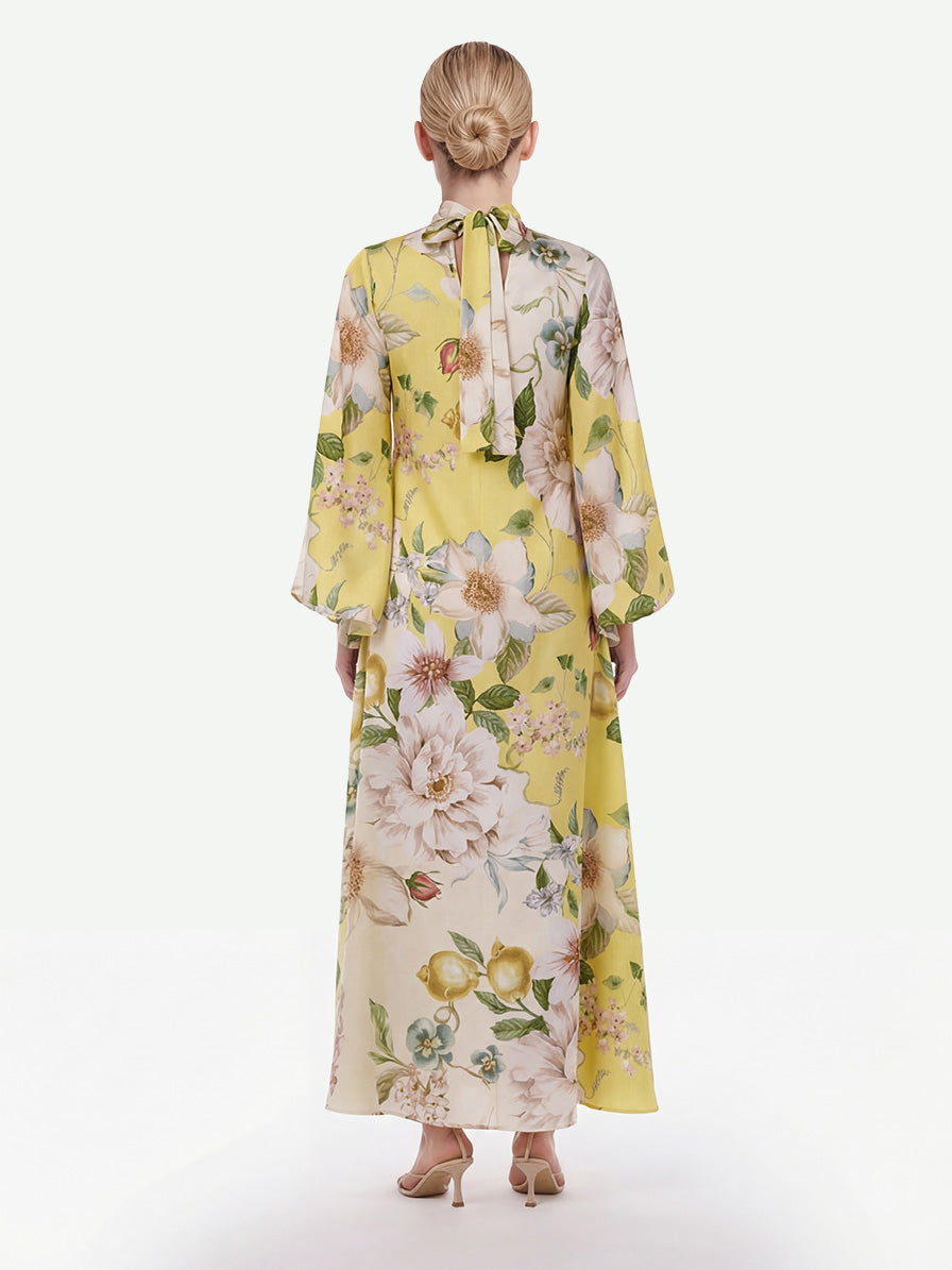 Robe longue élégante à imprimé floral et manches cloche