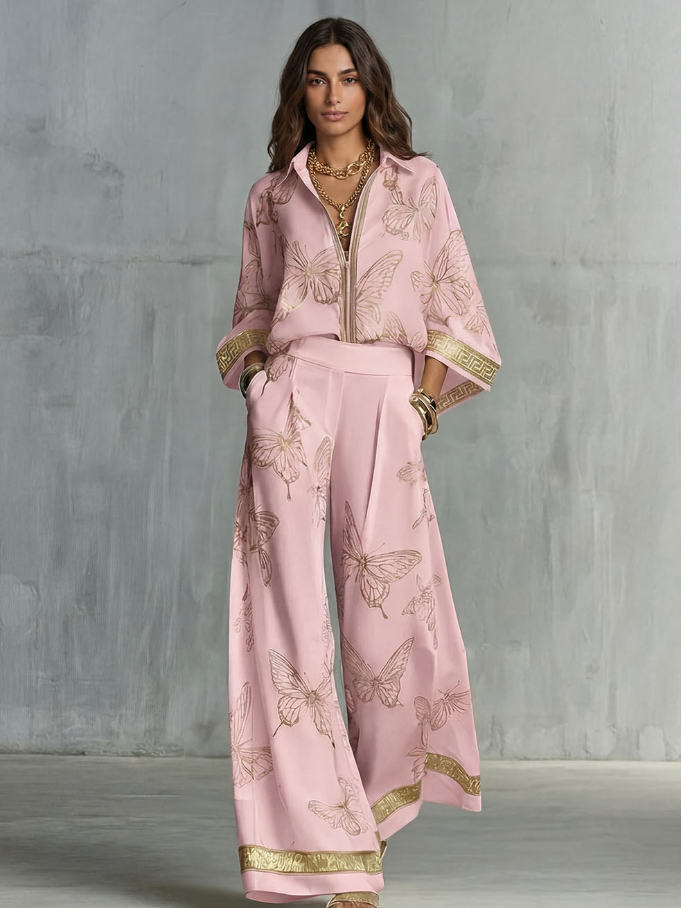 Set elegante con top con zip e stampa a farfalle e pantaloni a gamba larga