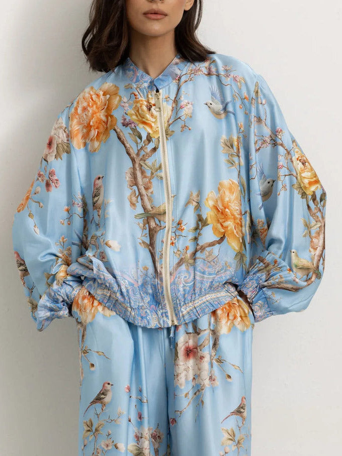 Eleganti pantaloni a gamba larga con stampa floreale e di uccelli