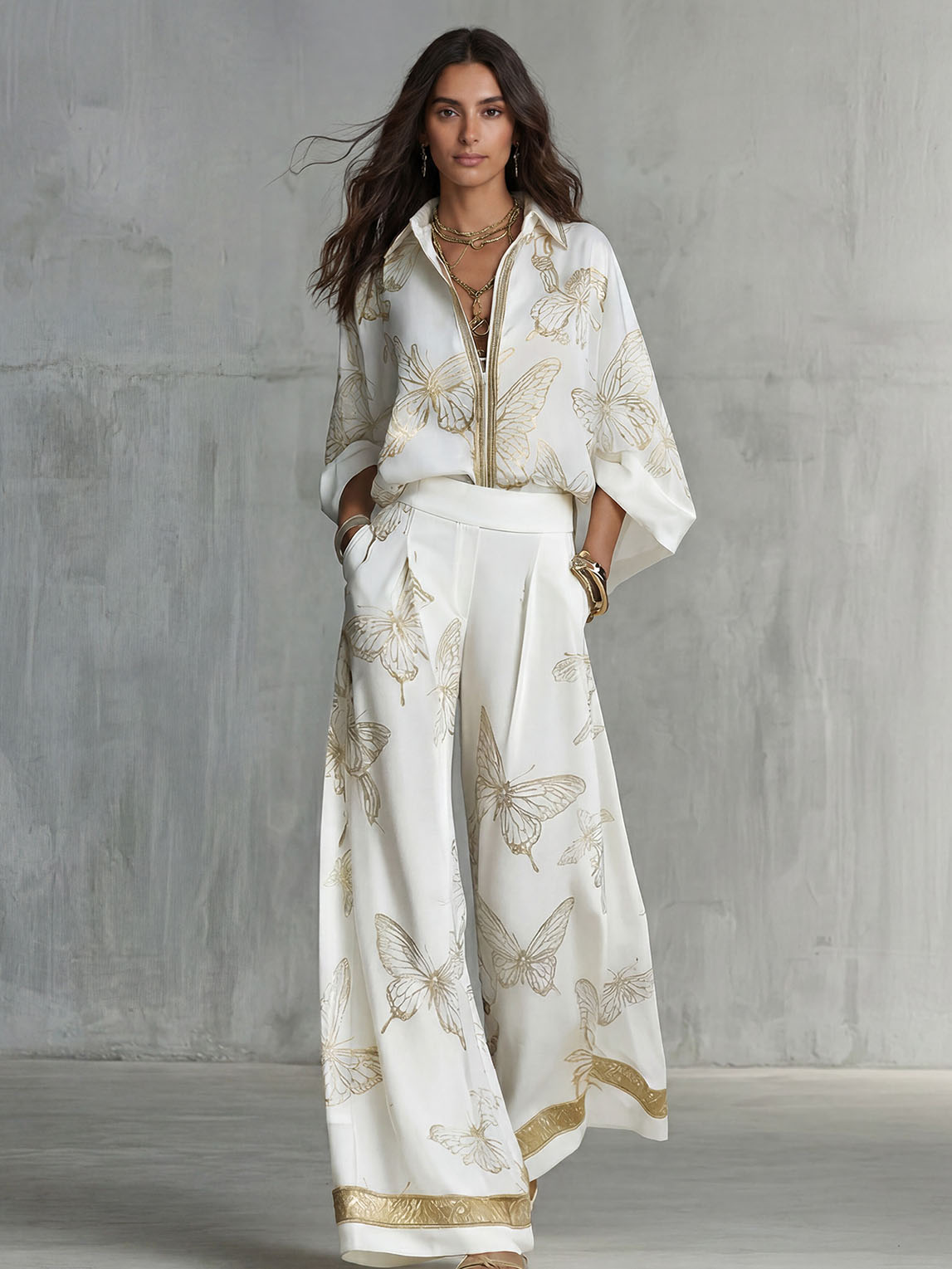 Set elegante con top con zip e stampa a farfalle e pantaloni a gamba larga