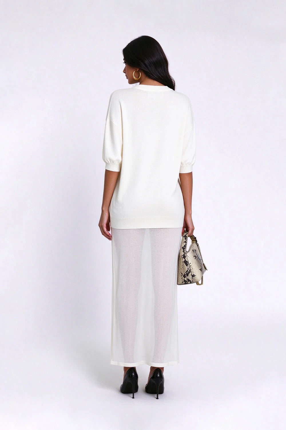 Vestido largo de punto con cuello redondo, hombros caídos y falda transparente