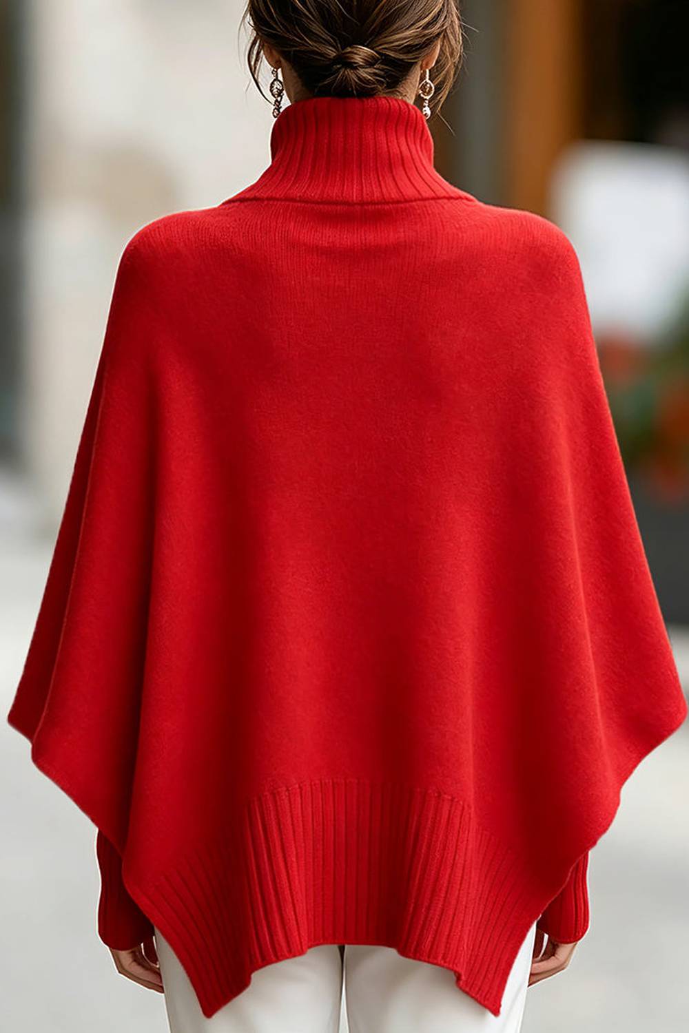 Turtleneck Knitted Cape Worn Over A Long Sleeved Sweater