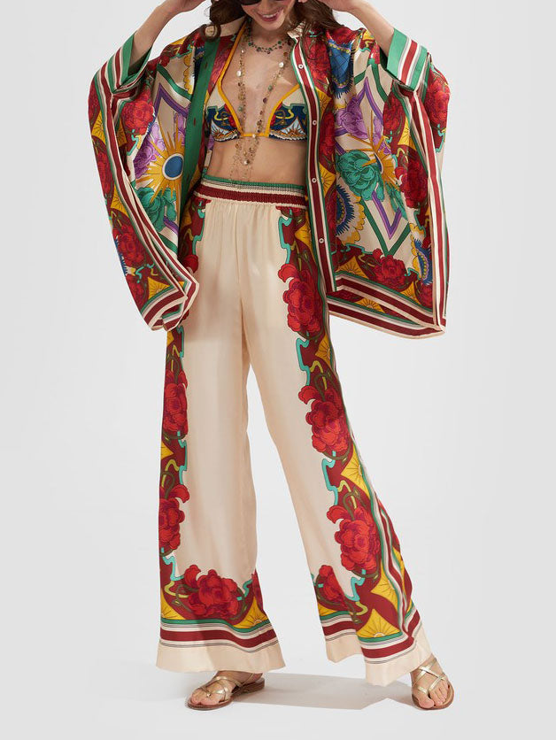 Calças largas requintadas com estampado floral e cintura elástica