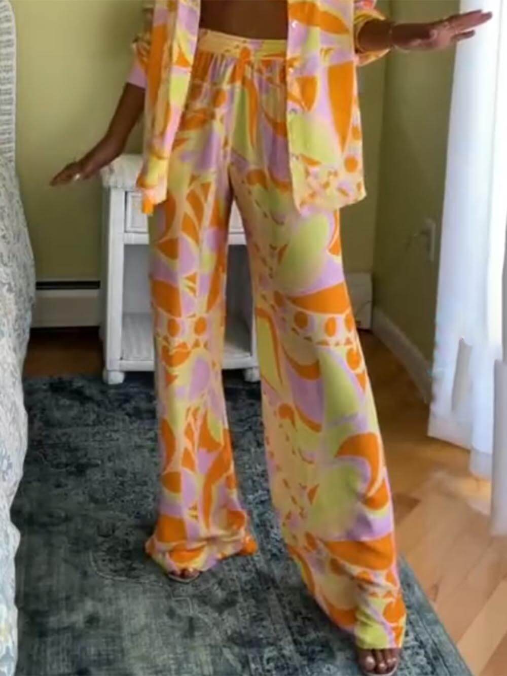 Pantaloni classici ampi con stampa, vita elasticizzata e tasche