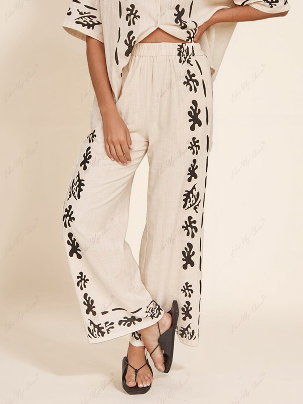 Schwarze bedruckte Hose mit weitem Bein in Creme