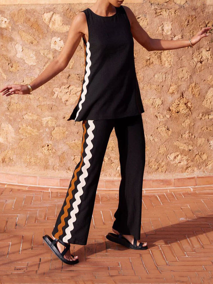 Conjunto de dos piezas con top holgado sin mangas y abertura, y pantalones de pierna ancha