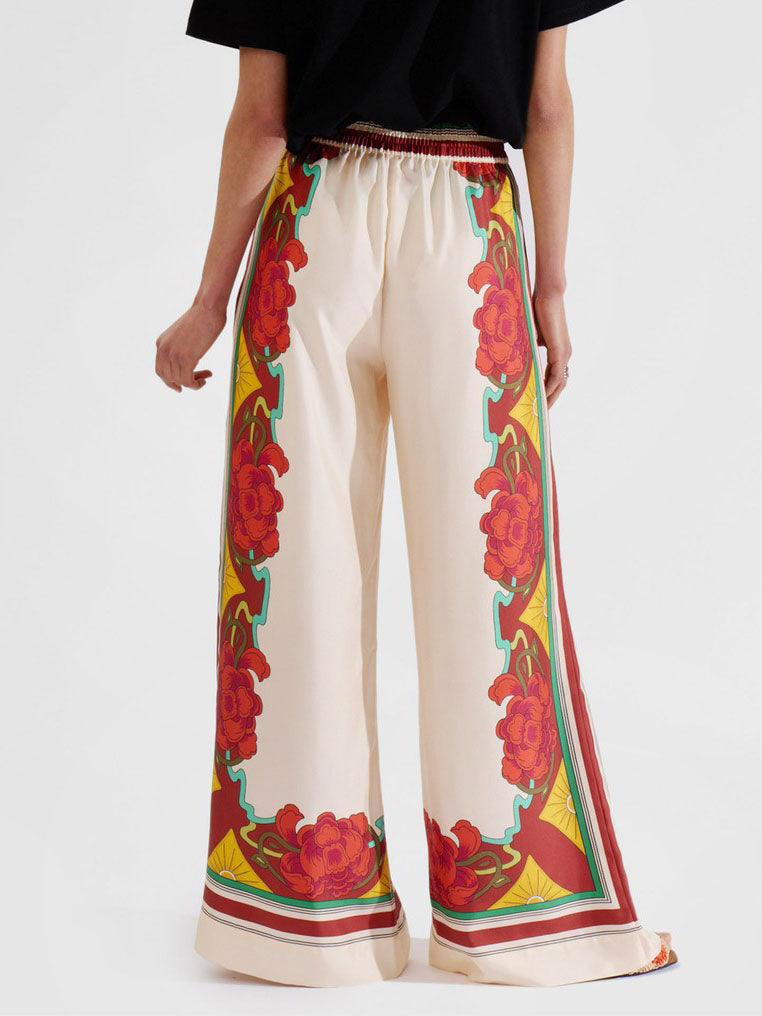 Calças largas requintadas com estampado floral e cintura elástica