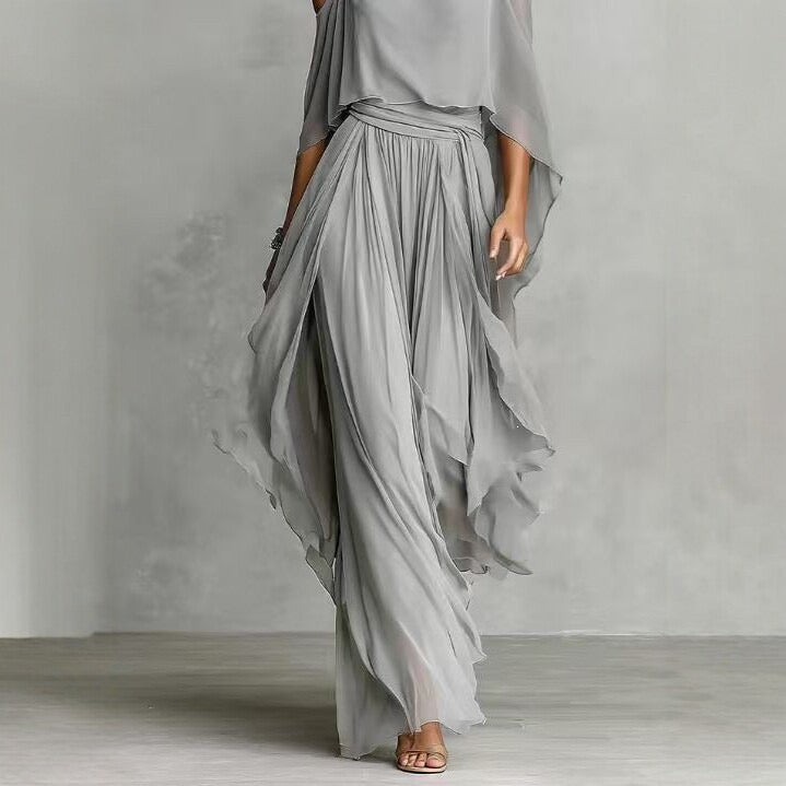 Completo elegante a due pezzi con top in chiffon a spalle scoperte e pantaloni a gamba larga