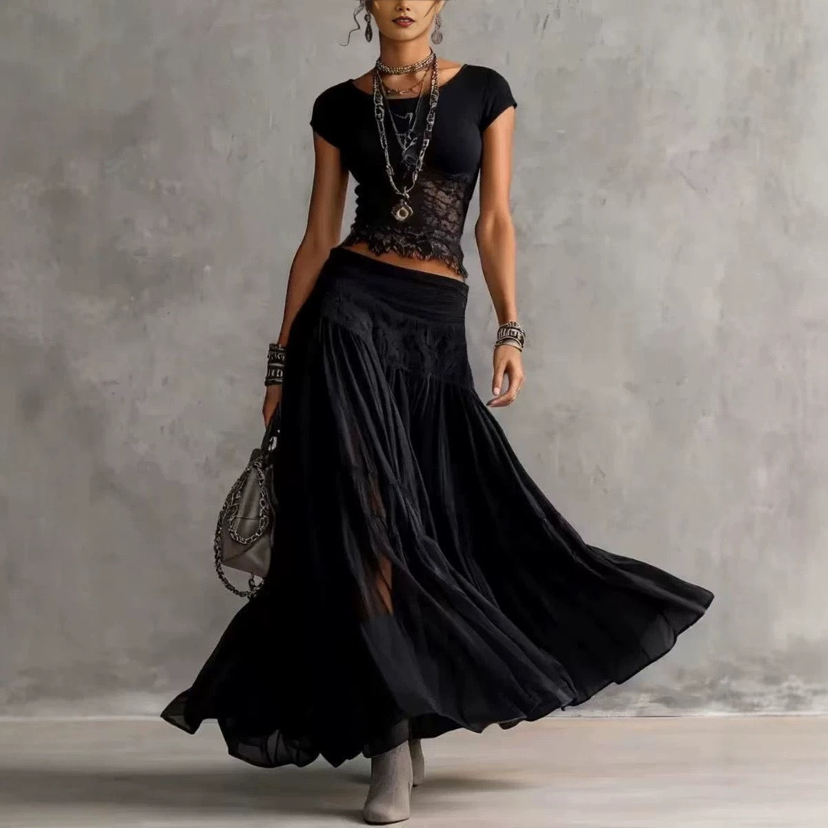 Conjunto de duas peças boémio com top curto de malha com acabamento em renda e saia maxi de chiffon em camadas