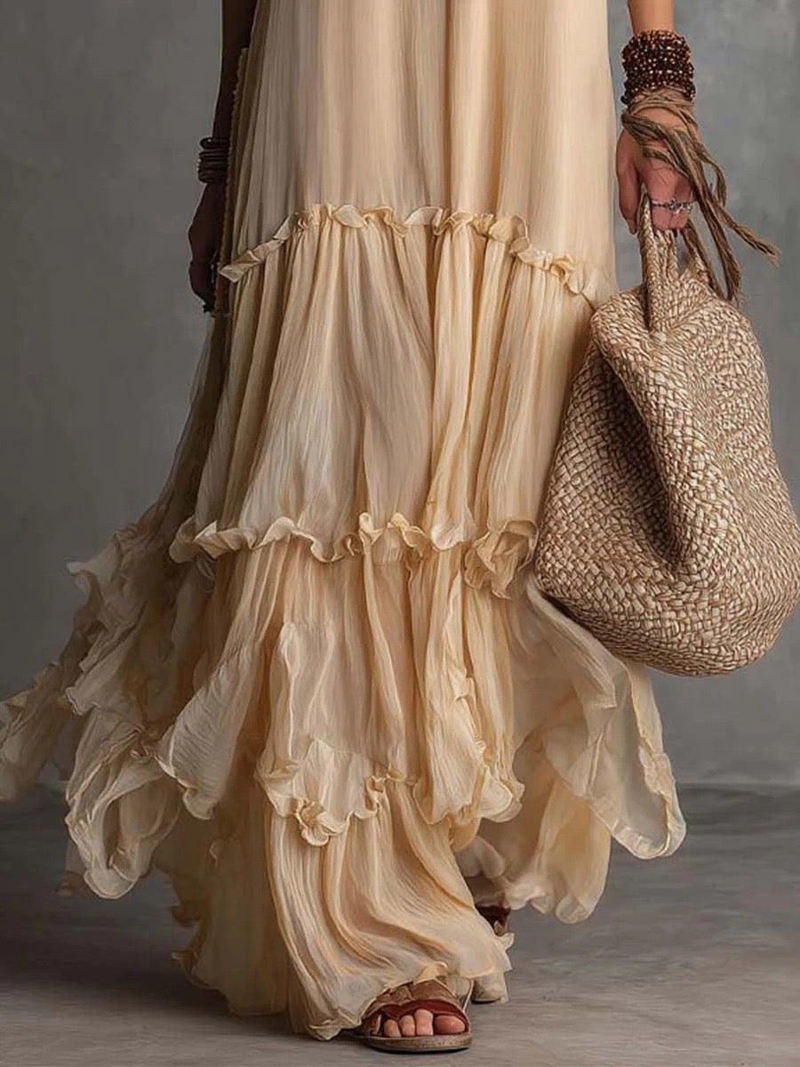 Vestido de chiffon boémio sem mangas, com decote redondo, gola com costas descobertas e folhos em camadas