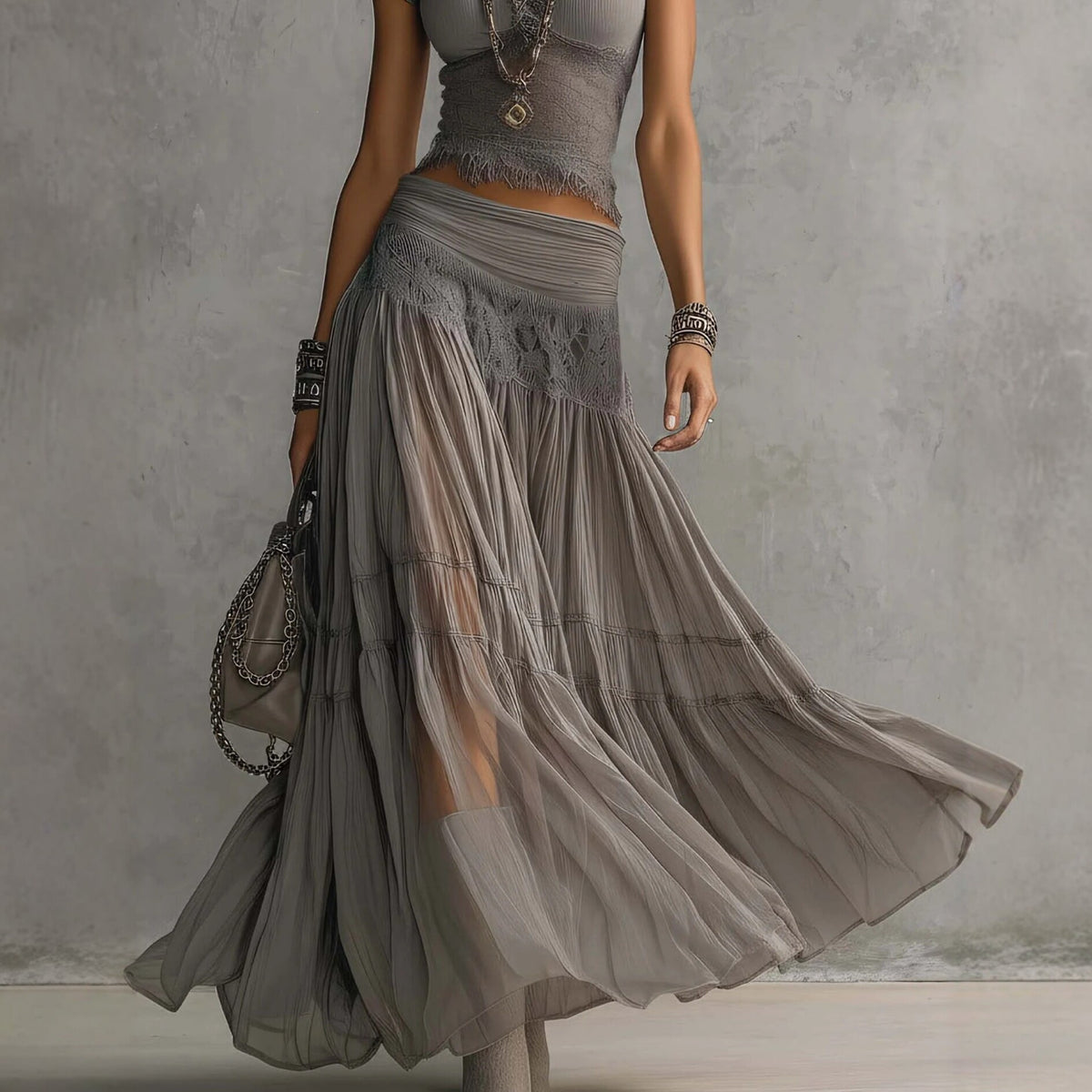 Conjunto de duas peças boémio com top curto de malha com acabamento em renda e saia maxi de chiffon em camadas